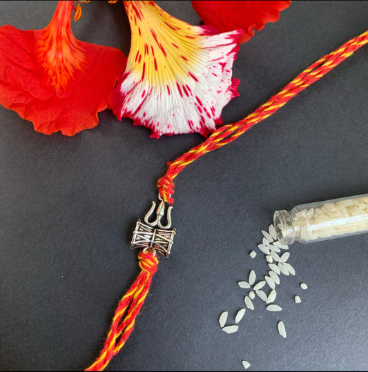 Trishul rakhi with cotton thread